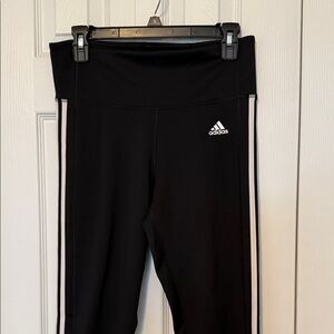 Adidas women’s  Black joggers with White Stripes.